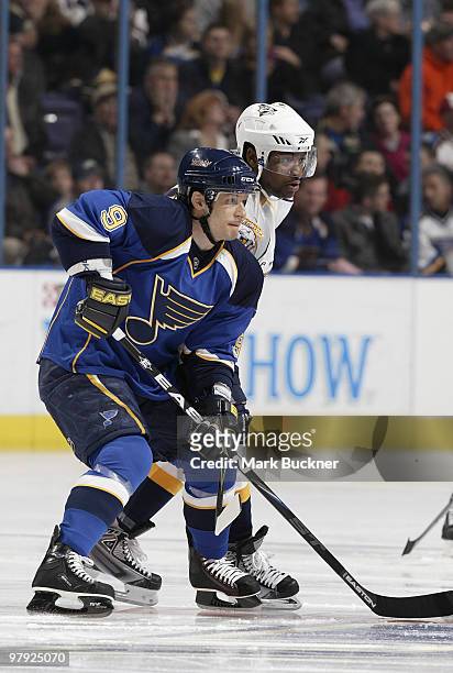 Paul Kariya of the St. Louis Blues and Joel Ward of the Nashville Predators wait for a face off on March 21, 2010 at Scottrade Center in St. Louis,...