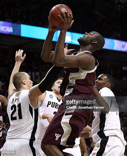 Bryan Davis of the Texas A&M Aggies shoots over D.J. Byrd of the Purdue Boilermakers during the second round of the 2010 NCAA men's basketball...