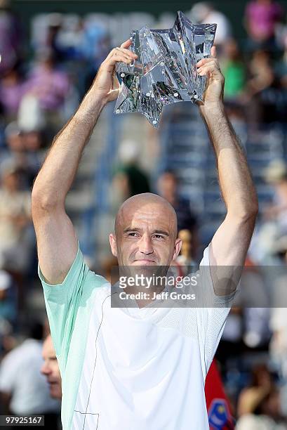 Ivan Ljubicic of Croatia poses with the trophy following his victory over Andy Roddick during the men's final of the BNP Paribas Open at the Indian...