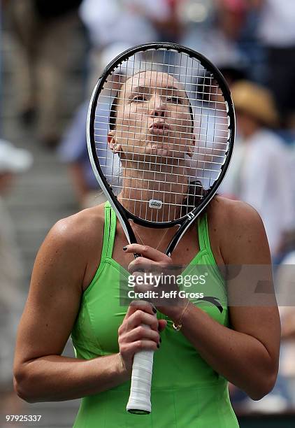 Jelena Jankovic of Serbia celebrates by kissing her raquet following her victory over Caroline Wozniacki of Denmark during the women's final of the...