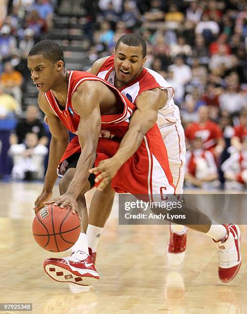 Louis Dale of the Cornell Big Red dribbles the ball while defended by Jordan Taylor of the Wisconsin Badgers during the second round of the 2010 NCAA...