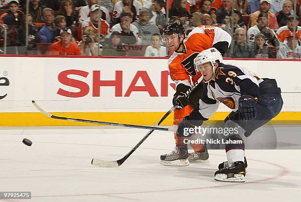 Claude Giroux of the Philadelphia Flyers shoots on goal next to Tobias Enstrom of the Atlanta Thrashers at the Wachovia Center on March 21, 2010 in...