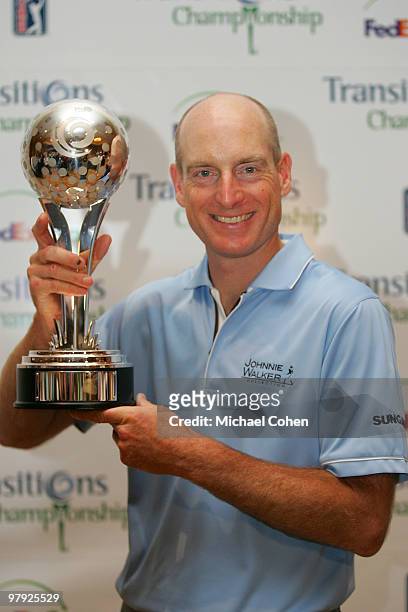 Jim Furyk holds the trophy after winning the Transitions Championship at the Innisbrook Resort and Golf Club held on March 21, 2010 in Palm Harbor,...