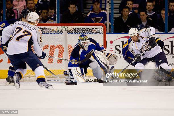 Chris Mason of the St. Louis Blues defends against Steve Sullivan of the Nashville Predators at the Scottrade Center on March 21, 2010 in St. Louis,...