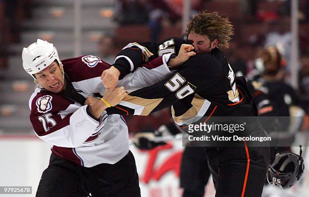 Chris Stewart of the Colorado Avalanche and Troy Bodie of the Anaheim Ducks fight in the first period during their NHL game at the Honda Center on...