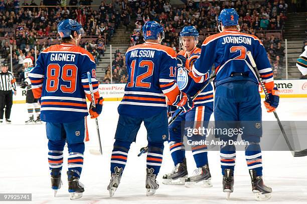 Sam Gagner, Robert Nilsson, Taylor Chorney and Aaron Johnson of the Edmonton Oilers celebrate a first period goal against the San Jose Sharks at...