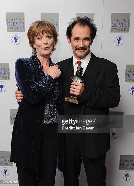 Mark Rylance, poses with his 'Best Actor' award with presenter Samantha Bond during the Laurence Olivier Awards at The Grosvenor House Hotel, on...