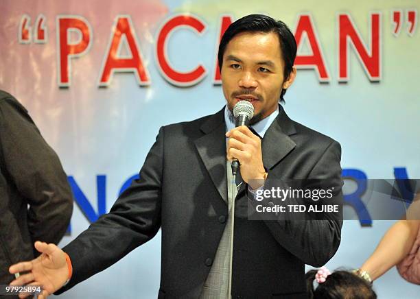 Filipino boxing superstar Manny Pacquiao speaks during a press conference shortly after arriving from the US at Manila international airport on March...