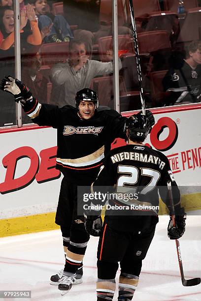 Teemu Selanne of the Anaheim Ducks celebrates his 600th career goal with teammate Scott Niedermayer against the Colorado Avalanche during the game on...