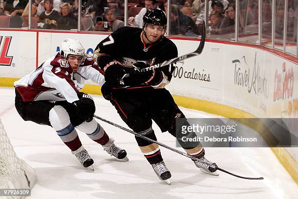 Steve Eminger of the Anaheim Ducks skates against Peter Budaj the Colorado Avalanche during the game on March 21, 2010 at Honda Center in Anaheim,...