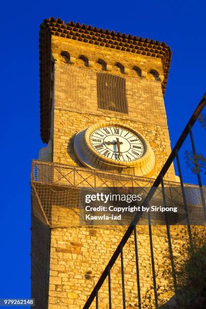 an ancient clock tower in cannes, provence-alpes-côte d'azur, france. - copyright by siripong kaewla iad stock pictures, royalty-free photos & images