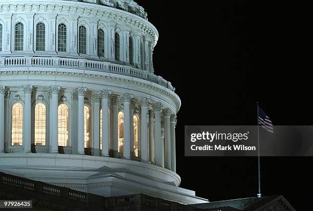 Lights are on at the US Capitol as the House of Representatives works during a rare Sunday session on March 21, 2010 in Washington, DC. Later tonight...