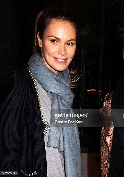 Former model/actress Elle McPherson attends the Yves Saint-Laurent Exhibition Launch - Paris Fashion Week at Petit Palais on March 10, 2010 in Paris,...