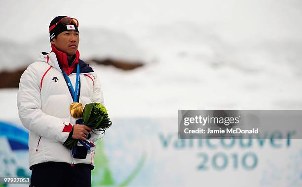 Gold medalist Yoshihiro Nitta of Japan celebrates at the medal ceremony for the Men's 1km Standing Cross-Country Sprint during Day 10 of the 2010...