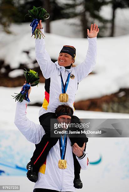 Gold medalist Verena Bentele of Germany and guide Thomas Friedrich celebrate at the medal ceremony for the Women's 1km Visually Impaired...