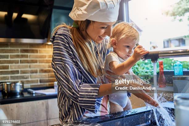 time to wash hands - baby chef stock pictures, royalty-free photos & images
