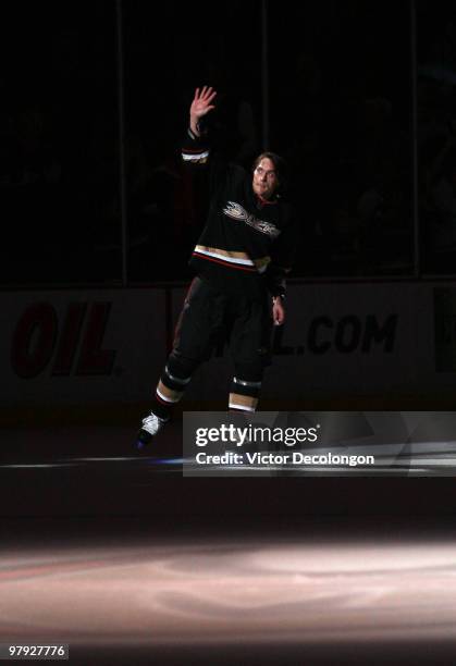 Teemu Selanne of the Anaheim Ducks skates to center ice to acknowledge the fans after the game against the Colorado Avalanche in which Selanne scored...