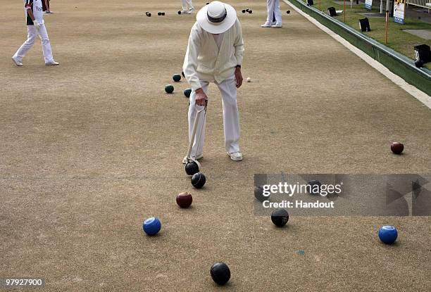 Reg Trewin, 101 the oldest competitor at the games competes in the Lawn Bowls event during the Sydney 2009 World Masters Games at Birrong Bowling and...