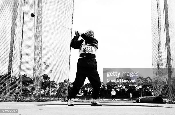 Takashi Ogura aged 86 from Japan competes in the 80 years + Hammer final at the Athletics warm up track during the Sydney 2009 World Masters Games at...