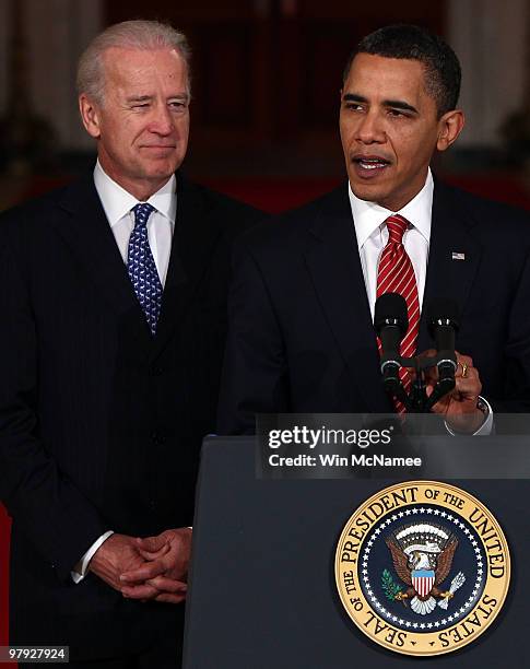 President Barack Obama , with Vice President Joe Biden , speaks from the East Room of the White House after passage of his health care reform...