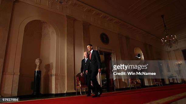 President Barack Obama and Vice President Joseph Biden walk to the East Room of the White House to speak after passage of Obama's health care reform...