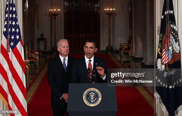 President Barack Obama , with Vice President Joseph Biden , speaks from the East Room of the White House after passage of his health care reform...