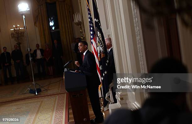 President Barack Obama , with Vice President Joseph Biden , speaks from the East Room of the White House after passage of Obama's health care reform...