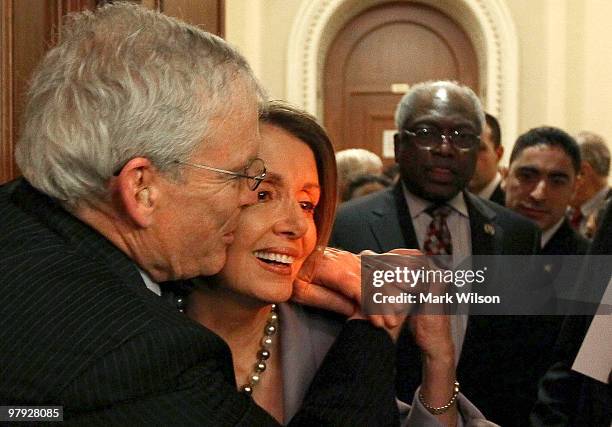 Ron Pollack of Families USA, kisses House Speaker Nancy Pelosi on the cheek after the House passed the health care vote on Capitol Hill on March 22,...