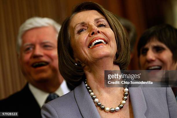 Speaker of the House Nancy Pelosi has a laugh during a news conference after the House passed health care reform legislation at the U.S. Capitol...