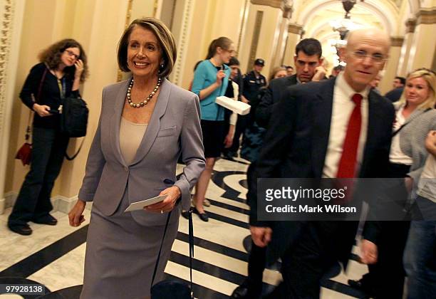 House Speaker Nancy Pelosi walks to a news conference after the health care vote on Capitol Hill on March 22, 2010 in Washington, DC. The House...