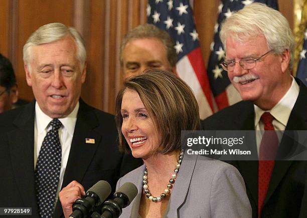 House Speaker Nancy Pelosi speaks at a news conference as House Majority Leader Steny Hoyer , and George Miller listen in after the health care vote...