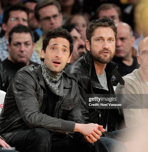 Gerard Butler and Adrien Brody attend a game between the Washington Wizards and the Los Angeles Lakers at Staples Center on March 21, 2010 in Los...