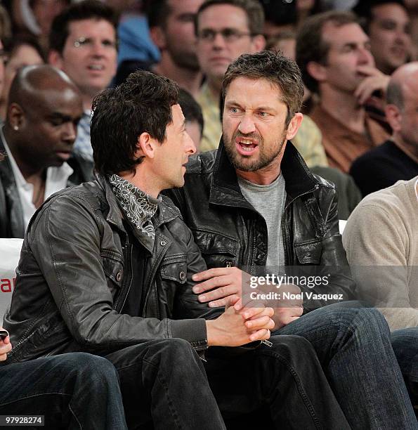 Gerard Butler and Adrien Brody attend a game between the Washington Wizards and the Los Angeles Lakers at Staples Center on March 21, 2010 in Los...