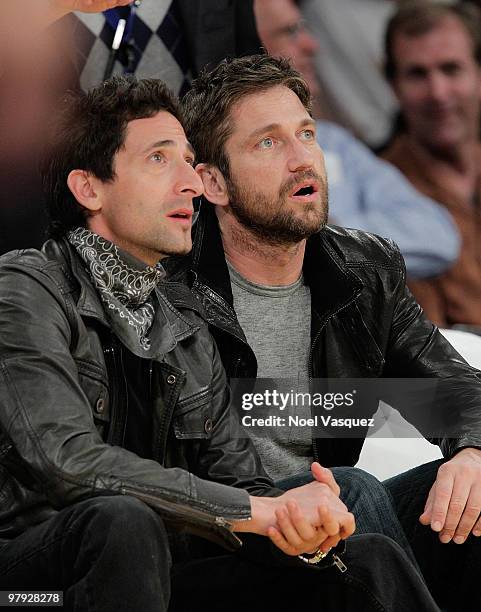 Gerard Butler and Adrien Brody attend a game between the Washington Wizards and the Los Angeles Lakers at Staples Center on March 21, 2010 in Los...