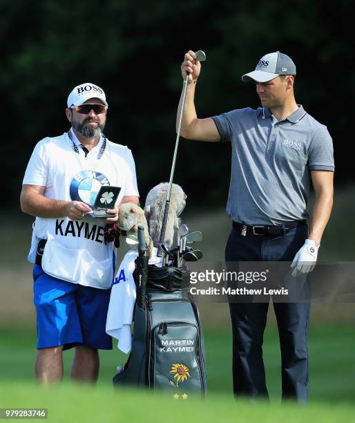Martin Kaymer of Germany looks on with his caddie Craig Connelly during a practice round ahead of the BMW International Open at Golf Club Gut...