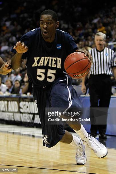 Jordan Crawford of the Xavier Musketeers moves the ball against against the Pittsburgh Panthers in the second half during the second round of the...