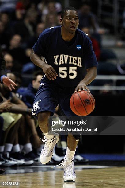 Jordan Crawford of the Xavier Musketeers moves the ball against against the Pittsburgh Panthers in the second half during the second round of the...