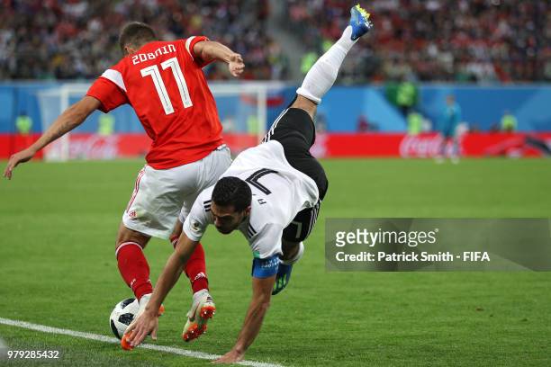 Roma Zobnin of Russia challenges Ahmed Fathi of Egypt in the second half during the 2018 FIFA World Cup Russia group A match between Russia and Egypt...