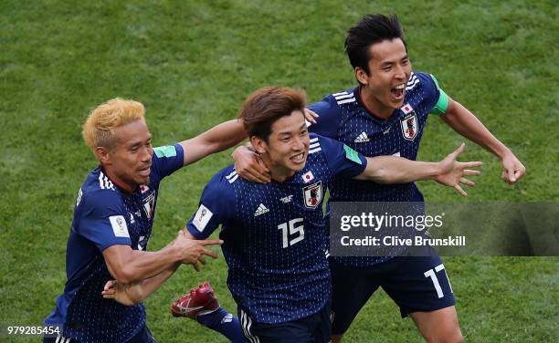 Yuya Osako of Japan celebrates scoring the 2nd Japan goal to make it 2-1 with Yuto Nagatomo and Makoto Hasebe of Japan during the 2018 FIFA World Cup...