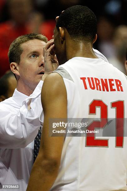 Trainer works on the face of Evan Turner of the Ohio State Buckeyes while taking on the Georgia Tech Yellow Jackets in the first half during the...