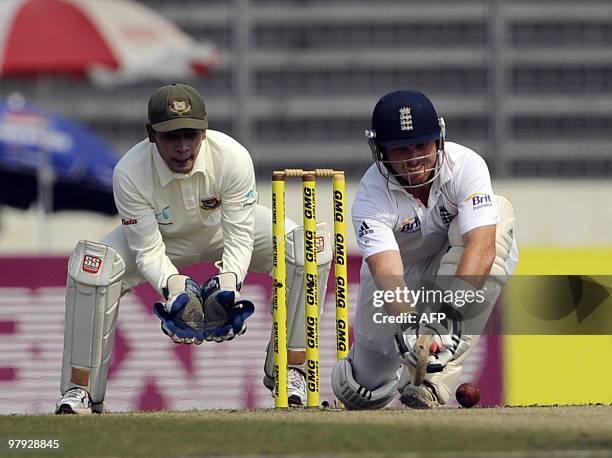 Bangladeshi cricketer Mushfiqur Rahim watches England cricketer Ian Bell plays a shot during the third day of the second test match between...