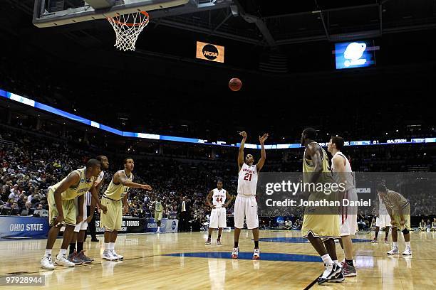 Evan Turner of the Ohio State Buckeyes shoots a free throw in the second half while taking on the Georgia Tech Yellow Jackets during the second round...