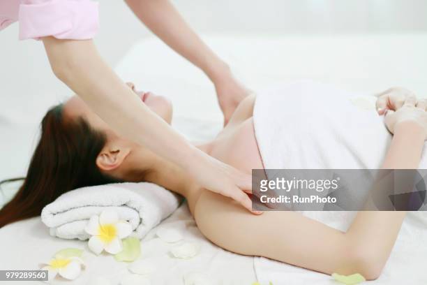 young woman receiving massage - body massage japan stock pictures, royalty-free photos & images