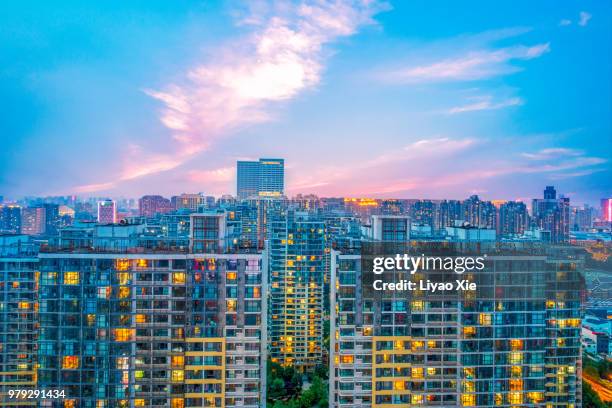 illuminated residential building - xie liyao stock pictures, royalty-free photos & images