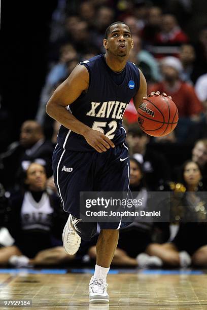 Terrell Holloway of the Xavier Musketeers moves the ball against against the Pittsburgh Panthers in the second half during the second round of the...