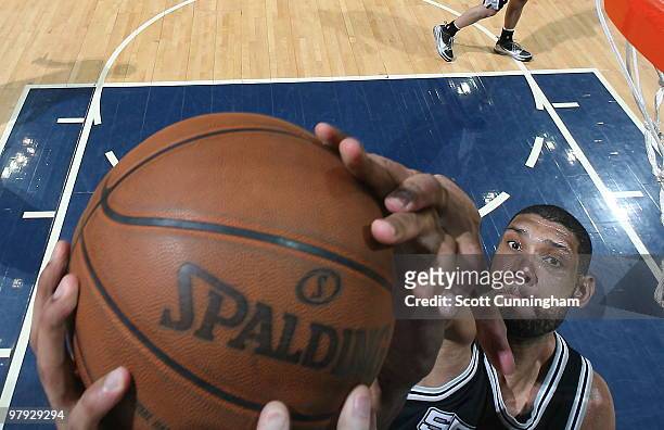 Tim Duncan of the San Antonio Spurs blocks a shot against the Atlanta Hawks on March 21, 2010 at Philips Arena in Atlanta, Georgia. NOTE TO USER:...