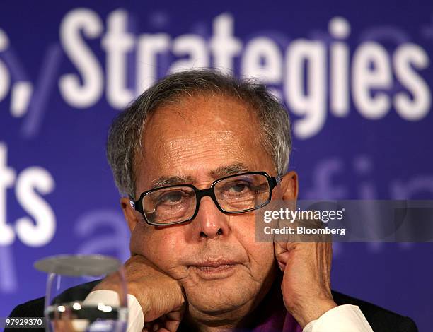 Pranab Mukherjee, India's finance minister, pauses during a Reserve Bank Of India and Organization for Economic Co-operation and Development...