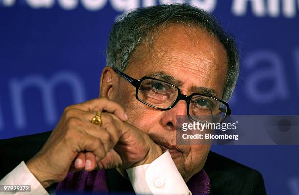 Pranab Mukherjee, India's finance minister, pauses during a Reserve Bank Of India and Organization for Economic Co-operation and Development...