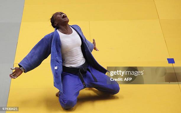 Colombian Diana Velasco celebrates after winning a golden medal in the women`s 63 kg judo competition during the IX South American Games in Medellin,...