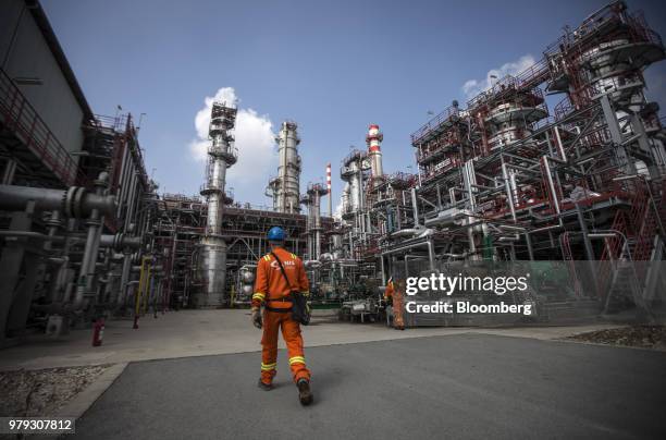 Worker walks through the refining complex at the Naftna Industrija Srbija AD oil refinery, operated by OAO Gazprom Neft PJSC, in Pancevo, Serbia, on...